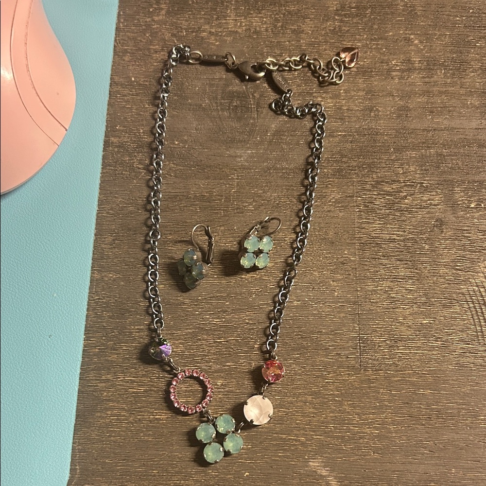 a Sabika necklace and matching earrings featuring colorful Swarovski crystals.